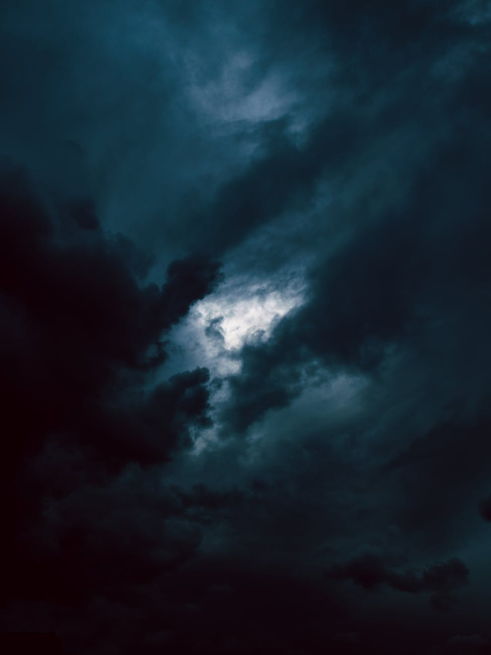 dark clouds with a bright light shining through